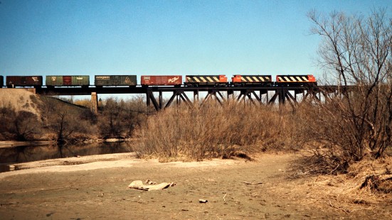 Eastbound Canadian National Railway freight train across bridge at Lenden, Ontario, on April 19, 1974. Photograph by John F. Bjorklund, © 2015, Center for Railroad Photography and Art. Bjorklund-19-23-16