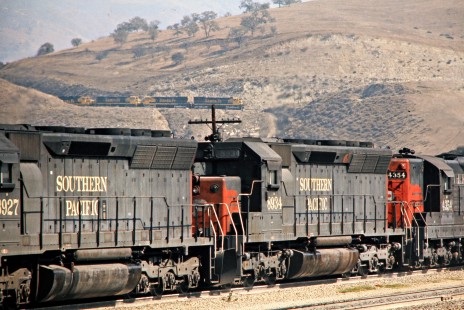 Santa Fe Railway freight train above Southern Pacific locomotives on Tehachapi grade in California, on October 15, 1976. Photograph by John F. Bjorklund, © 2015, Center for Railroad Photography and Art. Bjorklund-04-21-01
