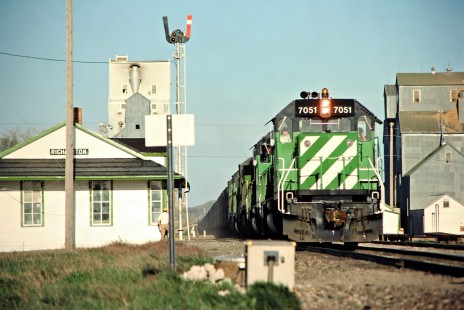 Westbound Burlington Northern Railroad freight train at depot in Richardton, North Dakota, on May 15, 1978. Photograph by John F. Bjorklund, © 2015, Center for Railroad Photography and Art. Bjorklund-09-22-17