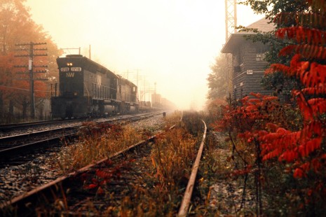 Westbound Norfolk and Western locomotives leading a Delaware and Hudson Railway freight train at SR tower in Susquehanna, Pennsylvania, on October 5, 1976. Photograph by John F. Bjorklund, © 2015, Center for Railroad Photography and Art. Bjorklund-18-23-11