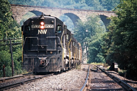 Northbound Delaware and Hudson Railway freight train with Norfolk and Western locomotives under the Starrucca Viaduct in Lanesboro, Pennsylvania, on July 22, 1975. Photograph by John F. Bjorklund, © 2015, Center for Railroad Photography and Art. Bjorklund-18-16-16