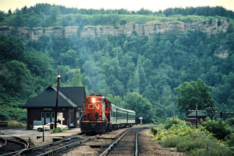 Westbound Canadian National Railway passenger train led by GP-series diesel no. 4106 in Dundas, Ontario, on July 3, 1976. Photograph by John F. Bjorklund, © 2015, Center for Railroad Photography and Art. Bjorklund-20-13-01