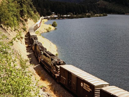 Mid-train helper locomotives in a British Columbia Railway freight train along Gates Lake at Birken, British Columbia, on August 6, 1985. Photograph by John F. Bjorklund, © 2015, Center for Railroad Photography and Art. Bjorklund-18-10-05