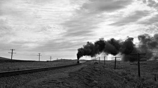 Union Pacific's eastbound <i>Overland Limited</i> passenger train climbing Wyoming's Sherman Hill. Photograph by Lucius Beebe and from John Gruber and John Ryan's presentation about the photography of Beebe and Charles Clegg at the Center's <a href="http://www.railphoto-art.org/conferences/conversations-2016/" rel="nofollow">Conversations 2016</a>.