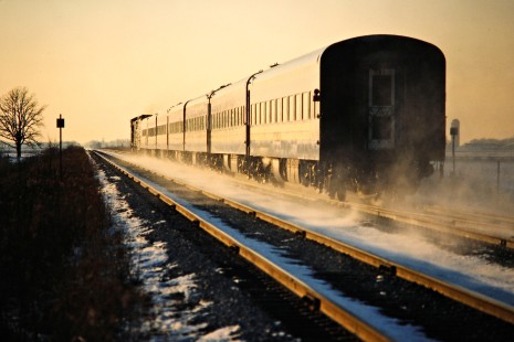 Westbound VIA Rail passenger train on the Canadian National Railway in Pointe-aux-Roches, Ontario, on January 4, 1987. Photograph by John F. Bjorklund, © 2015, Center for Railroad Photography and Art. Bjorklund-22-15-05