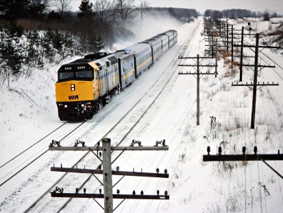 Eastbound VIA Rail passenger train on the Canadian National Railway in Hyde Park, Ontario, on January 31, 1987. Photograph by John F. Bjorklund, © 2015, Center for Railroad Photography and Art. Bjorklund-22-17-14