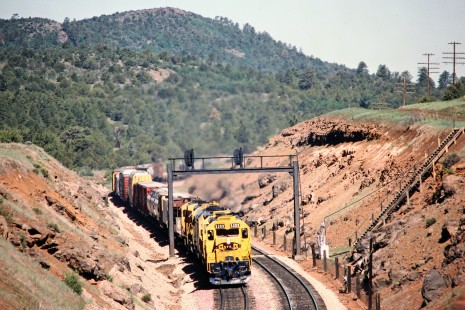 Santa Fe Railway freight train in Perrin, Arizona, on June 5, 1990.  Photograph by John F. Bjorklund, © 2015, Center for Railroad Photography and Art. Bjorklund-05-24-08