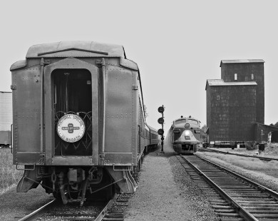 Wabash Railroad westbound freight train (right) at Tolono, Illinois, passing a special passenger train from St. Louis carrying fans for a University of Illinois football game on October 3, 1959. Photograph by J. Parker Lamb, © 2015, Center for Railroad Photography and Art. Lamb-01-037-04
