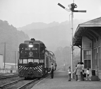 Southern Railway's eastbound <i>Asheville Special</i> eases to a stop at Old Fort, North Carolina, in August 1973. Many years after this incident, one of the children shown here got in touch with the photographer. By then an adult, she had seen the picture in a magazine and wanted a print to remind her of the enjoyable trip with her family. Photograph by J. Parker Lamb, © 2016, Center for Railroad Photography and Art. Lamb-01-085-01