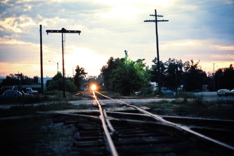 Southbound Ann Arbor Railroad freight train approaching the crossing of the Chesapeake & Ohio in Alma, Michigan, on sunset on July 10, 1976. Photograph by John F. Bjorklund, © 2015, Center for Railroad Photography and Art. Bjorklund-01-19-01