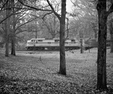Northbound Seaboard Air Line Railroad mail-express train no. 4 glides through tree-covered campus of North Carolina State University at Raleigh, North Carolina, in 1962. Photograph by J. Parker Lamb, © 2016, Center for Railroad Photography and Art. Lamb-01-077-01