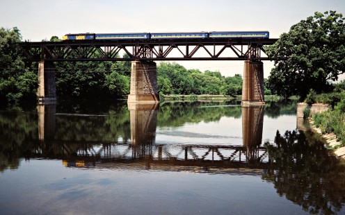 Westbound VIA Rail passenger train on the Canadian National Railway in Paris, Ontario, on June 18, 1983. Photograph by John F. Bjorklund, © 2015, Center for Railroad Photography and Art. Bjorklund-21-17-15
