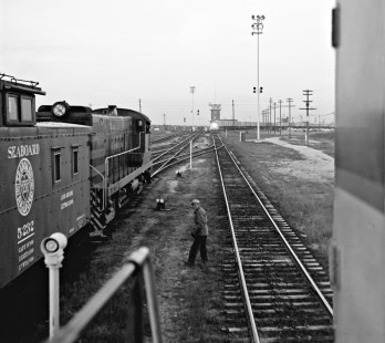 Northbound Seaboard Air Line Railroad TOFC (trailer-on-flatcar) extra train passes tower in Hamlet, North Carolina. View from replacement locomotives that the photographer rode. First of series that documents Lamb's ride to Hermitage yard in Richmond, Virginia, on October 20, 1961,  (Note: see <i>Trains</i>, May 1963). Photograph by J. Parker Lamb, © 2016, Center for Railroad Photography and Art. Lamb-01-079-01