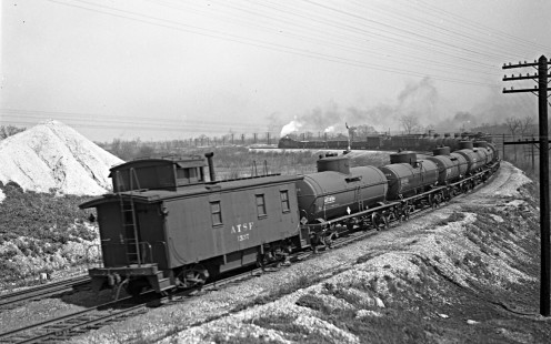 On the Santa Fe Railway's main line east of McCook, Illinois, a short eastbound freight train heads into Chicago on April 20, 1946. Photograph by Wallace W. Abbey, © 2015, Center for Railroad Photography and Art. Abbey-01-048-02