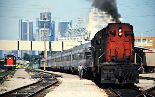 Eastbound Canadian National Railway passenger train in Windsor, Ontario, on July 5, 1976. Photograph by John F. Bjorklund, © 2015, Center for Railroad Photography and Art. Bjorklund-20-14-07