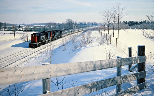 Westbound Canadian National Railway passenger train led by RS18 no. 3126 in Hyde Park, Ontario, on February 4, 1978. Photograph by John F. Bjorklund, © 2015, Center for Railroad Photography and Art. Bjorklund-20-17-15