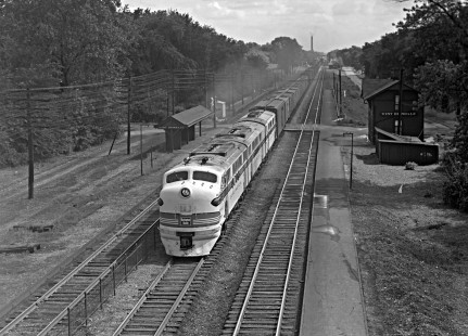 Three Chicago, Burlington & Quincy diesel-electric locomotives, led by F2A no. 151, pull a long westbound freight train through West Hinsdale, Illinois, on August 30, 1949. The train includes several refrigerated boxcars, likely returning west for another load of produce. Photograph by Wallace W. Abbey, © 2015, Center for Railroad Photography and Art. Abbey-01-087-05