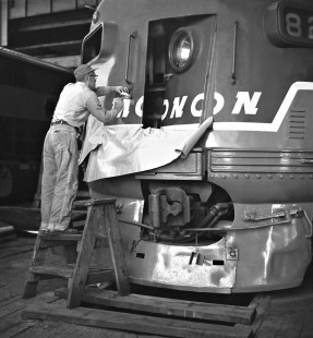 Monon Railroad working putting the final touches on a repair of one of the railroad's F3 diesel locomotives at Lafayette, Indiana, on May 31, 1960. Photograph by J. Parker Lamb, © 2015, Center for Railroad Photography and Art. Lamb-01-044-07