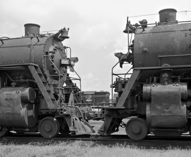 Retired Illinois Central Railroad 4-8-2 steam locomotives frame their successor, an EMD GP-series diesel, at Centralia, Illinois, in 1958. Photograph by J. Parker Lamb, © 2015, Center for Railroad Photography and Art. Lamb-01-027-08