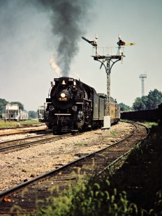 Nickel Plate Road 2-8-4 steam locomotive no. 765 pulling a westbound passenger excursion train on the Baltimore and Ohio Railroad in Indianapolis, Indiana, on August 26, 1984. Photograph by John F. Bjorklund, © 2015, Center for Railroad Photography and Art. Bjorklund-17-17-13