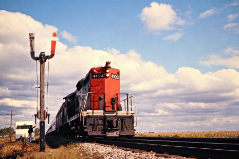 Westbound Canadian National Railway passenger train led by GP-series diesel no. 4103 passing the train order boards in Stony Point, Ontario, on September 22, 1974. Photograph by John F. Bjorklund, © 2015, Center for Railroad Photography and Art. Bjorklund-19-29-06