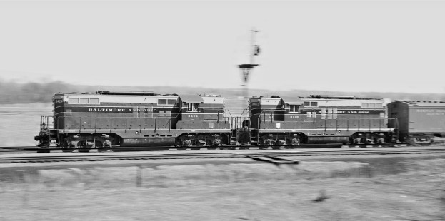 Two Baltimore and Ohio Railroad geeps accelerate northbound <i>Cincinnatian</i> passenger train past limits of the yard at North Dayton, Ohio, in March 1956. Photograph by J. Parker Lamb, © 2015, Center for Railroad Photography and Art. Lamb-01-004-04
