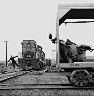 With the grace of a dancer, a Norfolk Southern Railway crewman swings off locomotive to throw switch in yard at Raleigh, North Carolina, in September 1961. Photograph by J. Parker Lamb, © 2016, Center for Railroad Photography and Art. Lamb-01-087-03