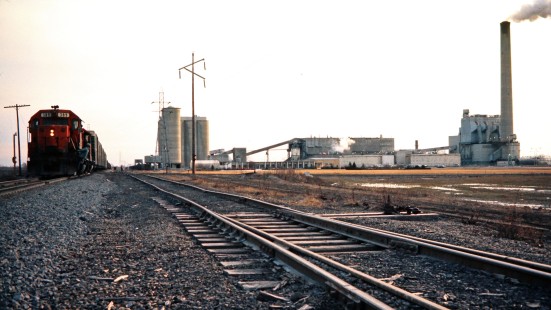 Northbound Ann Arbor Railroad TF5 passes Dundee Cement Plant in Dundee, Michigan, on February 1, 1975. Photograph by John F. Bjorklund, © 2015, Center for Railroad Photography and Art. Bjorklund-01-12-20