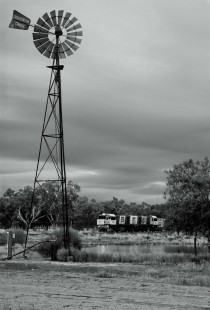 On Australia's Great Western Line, a cattle train passes a windmill at  Coolbinga in November 2011. Photograph by Alan Shaw, a presenter at the Center's <a href="http://www.railphoto-art.org/conferences/conversations-2016/" rel="nofollow">Conversations 2016</a>.