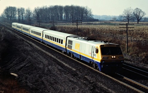 Eastbound VIA Rail passenger train on the Canadian National Railway in Hyde Park, Ontario, on November 24, 1984. Photograph by John F. Bjorklund, © 2015, Center for Railroad Photography and Art. Bjorklund-21-21-27