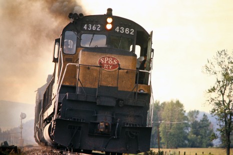 Eastbound Burlington Northern Railroad freight train (succeeded Spokane, Portland and Seattle Railway) near Elliston, Montana, on July 19, 1973. Photograph by John F. Bjorklund, © 2015, Center for Railroad Photography and Art. Bjorklund-08-05-20