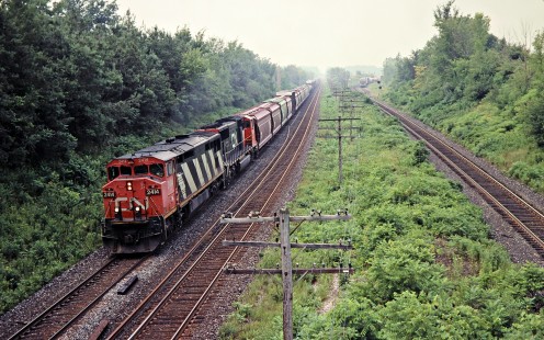 Eastbound Canadian National Railway freight train in Hyde Park, Ontario, on July 21, 2001. Photograph by John F. Bjorklund, © 2015, Center for Railroad Photography and Art. Bjorklund-23-12-07
