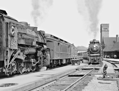 Westbound Canadian National Railway 4-8-4 steam locomotive no. 6181 passes station at London, Ontario, as Mike switches on July 6, 1958. Photograph by J. Parker Lamb, © 2015, Center for Railroad Photography and Art. Lamb-01-053-08