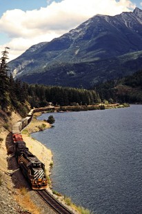 British Columbia Railway freight train along Gates Lake at Birken, British Columbia, on August 6, 1985. Photograph by John F. Bjorklund, © 2015, Center for Railroad Photography and Art. Bjorklund-18-10-07