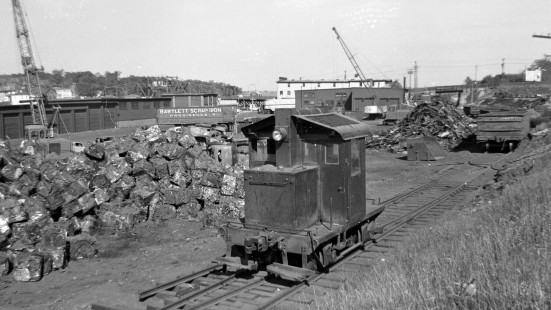 Industrial locomotive at the Bartlett Scrap Iron Company in East Providence, Rhode Island, some time between 1950 and 1955.  Photography by Leo King, © 2016, Center for Railroad Photography and Art. King-01-093-002