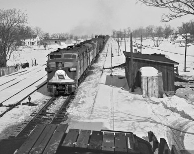 Second section of Wabash Railroad westbound freight train no. 89 behind FA diesel locomotive no. 1203A rumbling through the snow-covered village of Tolono, Illinois, on March 11, 1960. Photograph by J. Parker Lamb, © 2015, Center for Railroad Photography and Art. Lamb-01-036-05