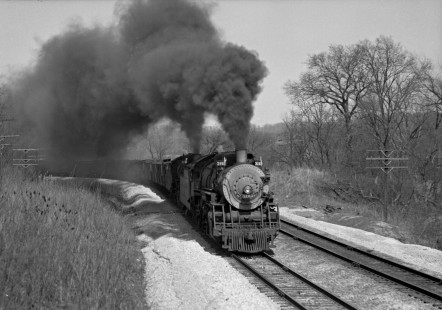 Atchison, Topeka & Santa Fe extra freight train with 2-8-2 steam locomotives nos. 3162 and 3160 climbs Olathe Hill west of Zarah, Kansas, on March 31, 1946. This part of the railroad has since been rebuilt, eliminating most of the curves. Photograph by Wallace W. Abbey, © 2015, Center for Railroad Photography and Art. Abbey-01-046-04