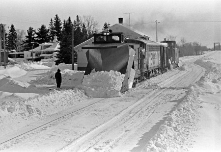 Soo Line plow train with an F7 diesel locomotive pushing Russell plow no. X-185 passing the depot at Palisade, Minnesota, in February 1969. Photograph by Wallace W. Abbey, © 2015, Center for Railroad Photography and Art. Abbey-07-008-08