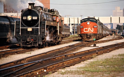 Eastbound Canadian National Railway steam locomotive no. 6060 and and diesel no. 6516 in Windsor, Ontario, on May 27, 1974. Photograph by John F. Bjorklund, © 2015, Center for Railroad Photography and Art. Bjorklund-19-27-16