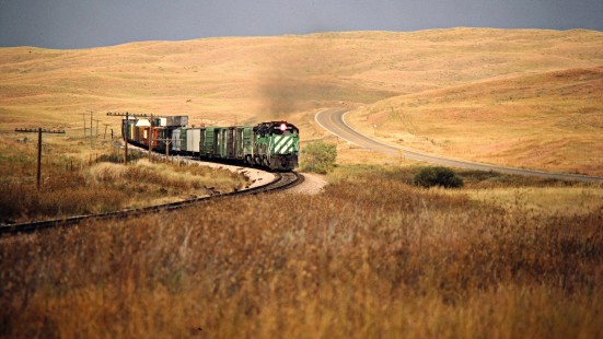 Westbound Burlington Northern Railroad freight train in Hyannis, Nebraska, on September 27, 1983. Photograph by John F. Bjorklund, © 2015, Center for Railroad Photography and Art. Bjorklund-12-15-05