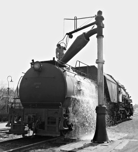 Baltimore and Ohio Railroad 2-8-2 steam locomotive gets washed from stuck water spout at Washington Court House, Ohio, in March 1956. Photograph by J. Parker Lamb, © 2015, Center for Railroad Photography and Art. Lamb-01-006-04