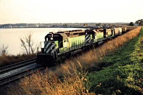 Northbound Burlington Northern Railroad  freight train curving around the Mississippi in Montrose, Iowa, on November 2, 1986. Photograph by John F. Bjorklund, © 2015, Center for Railroad Photography and Art. Bjorklund-13-21-15