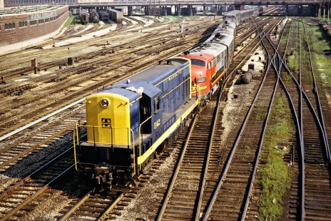 Santa Fe Railway Fairbanks-Morse H-12-44TS diesel locomotive no. 542 backing an Amtrak passenger train, still comprised mainly of Santa Fe equipment, into Union Station at Chicago, Illinois, on August 18, 1972. Photograph by John F. Bjorklund, © 2015, Center for Railroad Photography and Art. Bjorklund-04-10-22