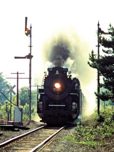 Eastbound Nickel Plate Road 2-8-4 steam locomotive no. 765 passing semaphores on the Baltimore and Ohio Railroad in Zionsville, Indiana, on August 26, 1984. Photograph by John F. Bjorklund, © 2015, Center for Railroad Photography and Art. Bjorklund-17-18-19