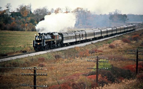 Eastbound Canadian National Railway passenger excursion train with steam locomotive no. 6060 in Fort Erie, Ontario, on October 27, 1973. Photograph by John F. Bjorklund, © 2015, Center for Railroad Photography and Art. Bjorklund-19-18-23