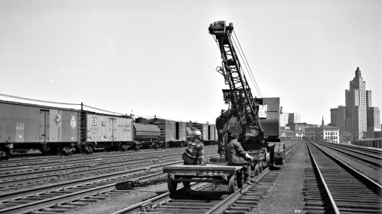Crew members with work crane on track near Union Station in Providence, Rhode Island, some time between 1950 and 1955. Photograph by Leo King, © 2016, Center for Railroad Photography and Art. King-01-079-001