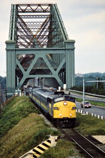 Westbound VIA Rail passenger train crossing the St. Lawrence River on the Canadian National Railway in Charny, Quebec, on August 21, 1986. Photograph by John F. Bjorklund, © 2015, Center for Railroad Photography and Art. Bjorklund-22-11-06