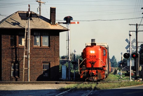 Southbound Ann Arbor Railroad freight train at Norfolk and Western Railway crossing in Milan, Michigan, on August 22, 1981. Photograph by John F. Bjorklund, © 2015, Center for Railroad Photography and Art. Bjorklund-03-26-10