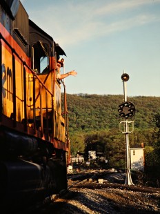 Engineer waves from his locomotive on the Baltimore and Ohio Railroad in Altamont, Maryland, on May 24, 1984. Photograph by John F. Bjorklund, © 2015, Center for Railroad Photography and Art. Bjorklund-17-10-18