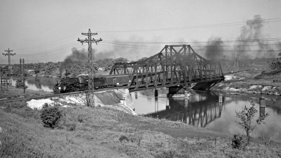 Atchison, Topeka & Santa Fe Railway passenger train "Second 4," the second section of the eastbound <i>California Limited</i> led by 4-6-2 steam locomotive no. 3404, crossing the Sanitary District canal at Bridge 9C east of McCook on its way into Chicago on June 23, 1946. Photograph by Wallace W. Abbey, © 2015, Center for Railroad Photography and Art. Abbey-01-055-03